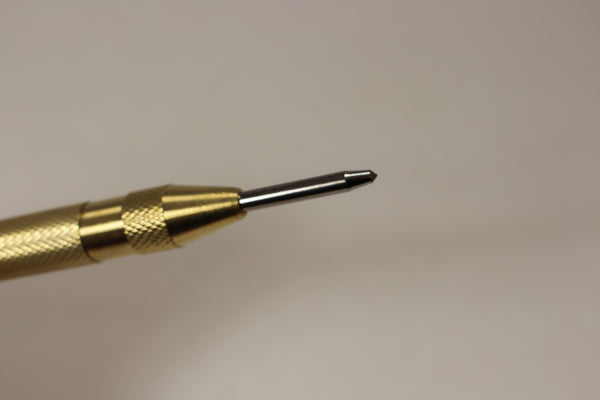 Spring loaded brass center punch