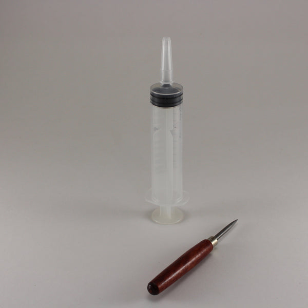 High capacity syringe with cap