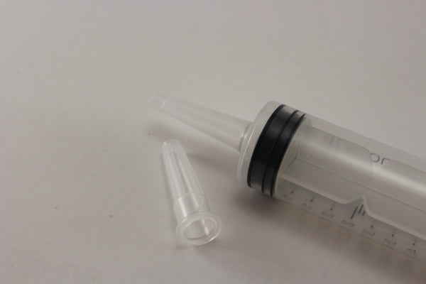 High capacity syringe with cap